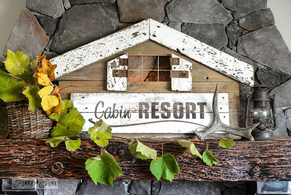 A cabin shaped Cabin Resort sign made with Funky Junk's Old Sign Stencils