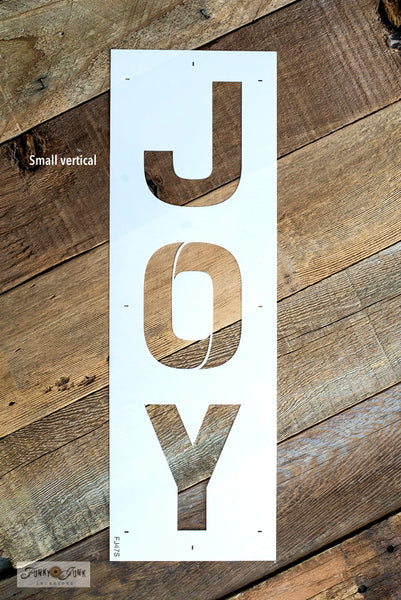 Joy - Small is a festive Christmas sign stencil design bursting with loads of creative mix & match options! Use Joy by itself in horizontal or vertical formats, with the option to replace the O in Joy with Accessories, that include 2 snowflakes, ornament, hook, ribbon, and to the world text. 