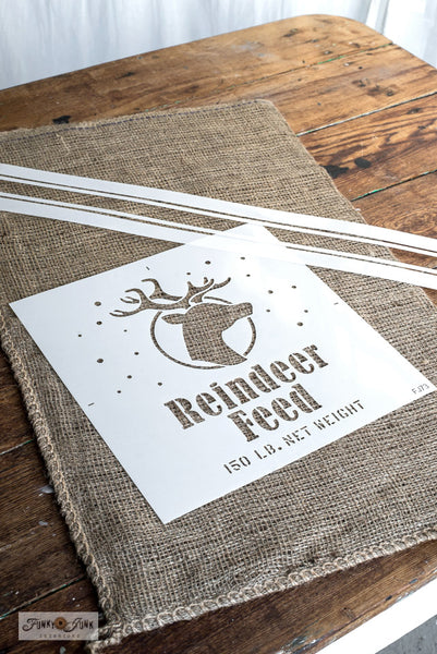 Reindeer Feed is a Christmas-themed stencil designed to mimic a feed grain sack. A reindeer head logo surrounded by gentle falling snow, along with a net weight  makes this one feel like the real deal. Perfect for signs, pillows, gifts, and would look charming as a Santa sack to wrap presents with!