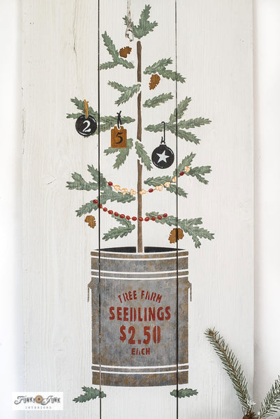 The Christmas Tree Seedling stencil features a Christmas tree seedling planted in a tin can, including a sign reading "Tree Farm Seedlings, 2.50 Each". This Christmas tree stencil features natural sparse branches attached to a woodsy stem, making decorating the tree so versatile! Makes the perfect Christmas porch sign!