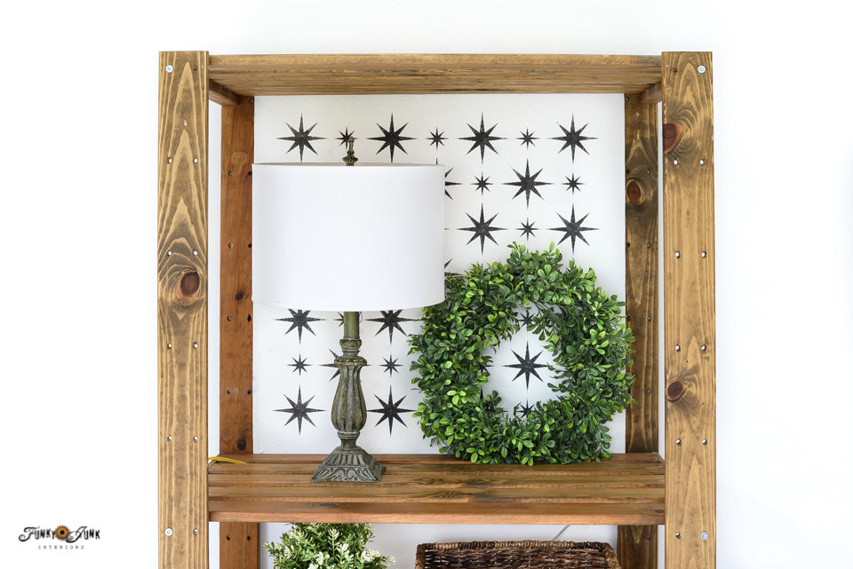 Retro Star stenciled backdrop inside a bookshelf by Funky Junk's Old Sign Stencils