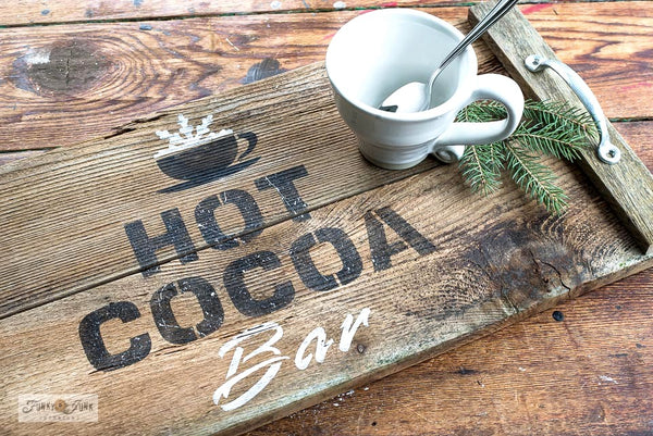 Deliver delicious winter vibes with our Hot Cocoa Bar Stencil by Funky Junk's Old Sign Stencils! Helps you create a warm and cozy sign for your hot cocoa station. Perfect for Christmas and all winter long, this Christmas stencil also includes a cute cup with a frosty snowflake.