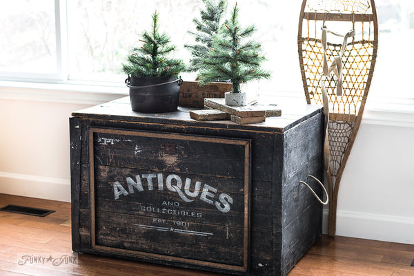 Reclaimed wood trunk enhanced with Antiques by Funky Junk's Old Sign Stencils. Celebrate your love for vintage collections, by painting your own old Antiques sign onto reclaimed wood, furniture, etc!