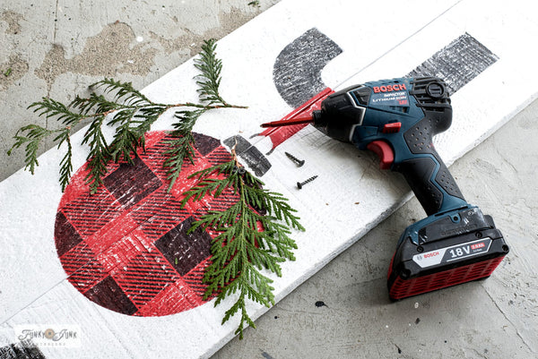 Learn how to stencil this festive JOY sign with a Buffalo Checked ornament! Made with Funky Junk's Old Sign Stencils.