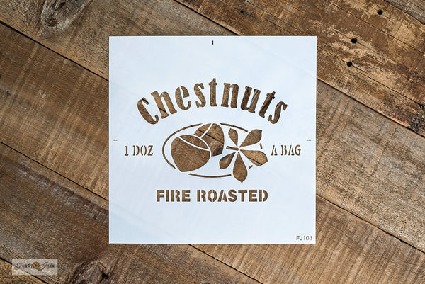 Chestnuts Fire Roasted stencil by Funky Junk's Old Sign Stencils is a Christmas stencil with a whimsical nut-theme! Designed with bold letters along with crate-styled serving info of 1 Doz A Bag, and a logo of 2 chestnut graphics nestled beside a chestnut tree leaf. Sized to create a pillow, tray or label a crate.