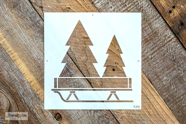 Fill your projects with festive winter vibes with the Christmas Trees with Sleigh stencil! This Christmas stencil design features two Christmas trees tucked into a crate placed on top of a sleigh, ready to be decorated! Sized perfectly for throw pillows or as a compact sign for Christmas decorating.