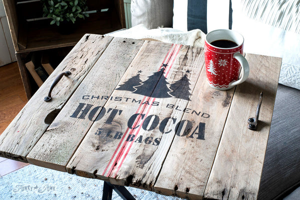 A pallet wood TV tray stenciled with Christmas Blend Hot Cocoa 5 LB Bags, a charming Christmas stencil that comes with a grain sack stripe. By Funky Junk's Old Sign Stencils