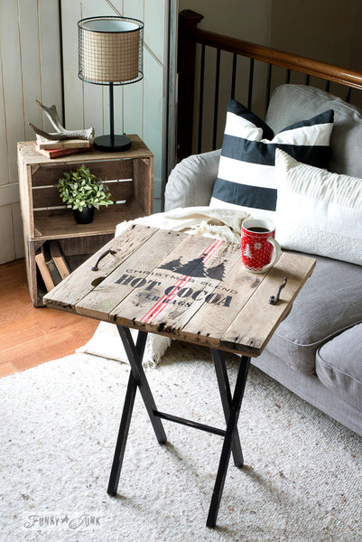A pallet wood TV tray stenciled with Christmas Blend Hot Cocoa 5 LB Bags, a charming Christmas stencil that comes with a grain sack stripe. By Funky Junk's Old Sign Stencils