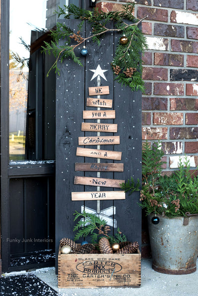 Pallet Christmas Tree is a unique vertical wood Christmas tree stencil designed as if it's built from pallet wood! Planks ranging from smaller to larger are attached to a center post, topped with a tree star, ending with a wood tree skirt. We Wish You A Merry Christmas is included. Makes a perfect Christmas porch sign.