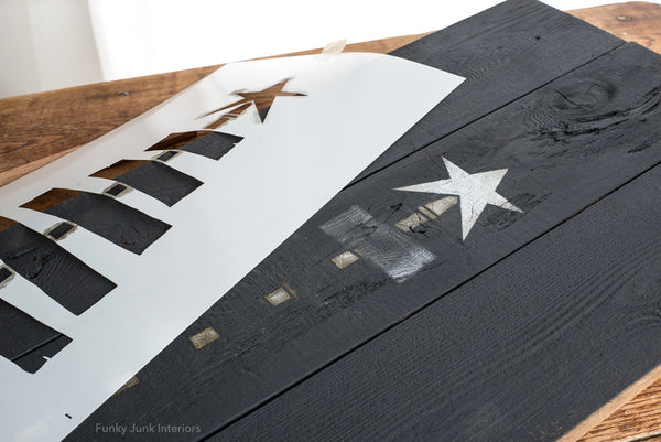 Pallet Christmas Tree is a unique vertical wood Christmas tree stencil designed as if it's built from pallet wood! Planks ranging from smaller to larger are attached to a center post, topped with a tree star, ending with a wood tree skirt. We Wish You A Merry Christmas is included. Makes a perfect Christmas porch sign.