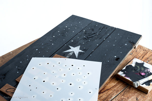 Pallet Christmas Tree is a unique vertical wood Christmas tree stencil designed as if it's built from pallet wood! Planks ranging from smaller to larger are attached to a center post, topped with a tree star, ending with a wood tree skirt. We Wish You A Merry Christmas is included. Makes a perfect Christmas porch sign.